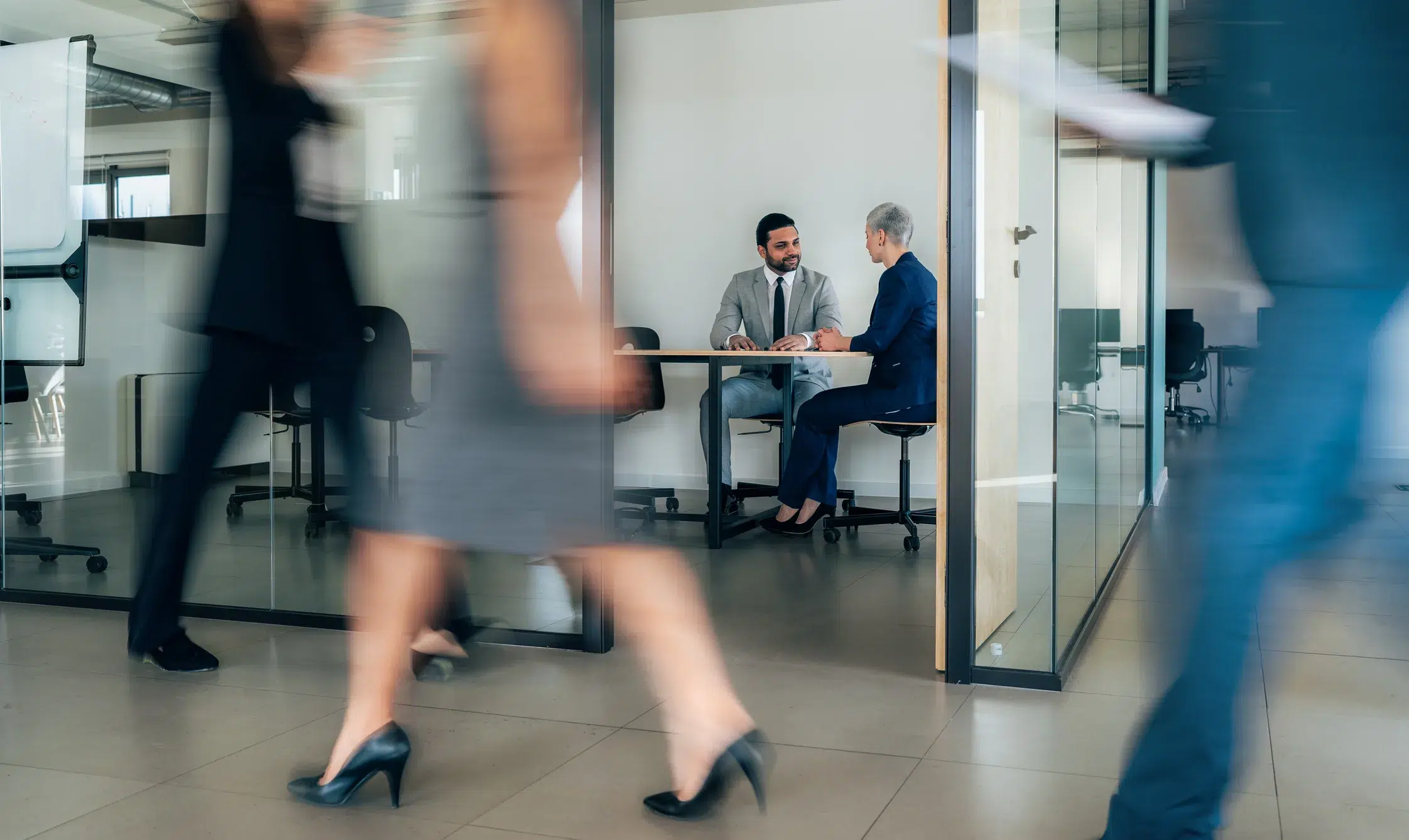 Busy modern workplace. Working process in the office, business people working, walking and talking, blurred motion