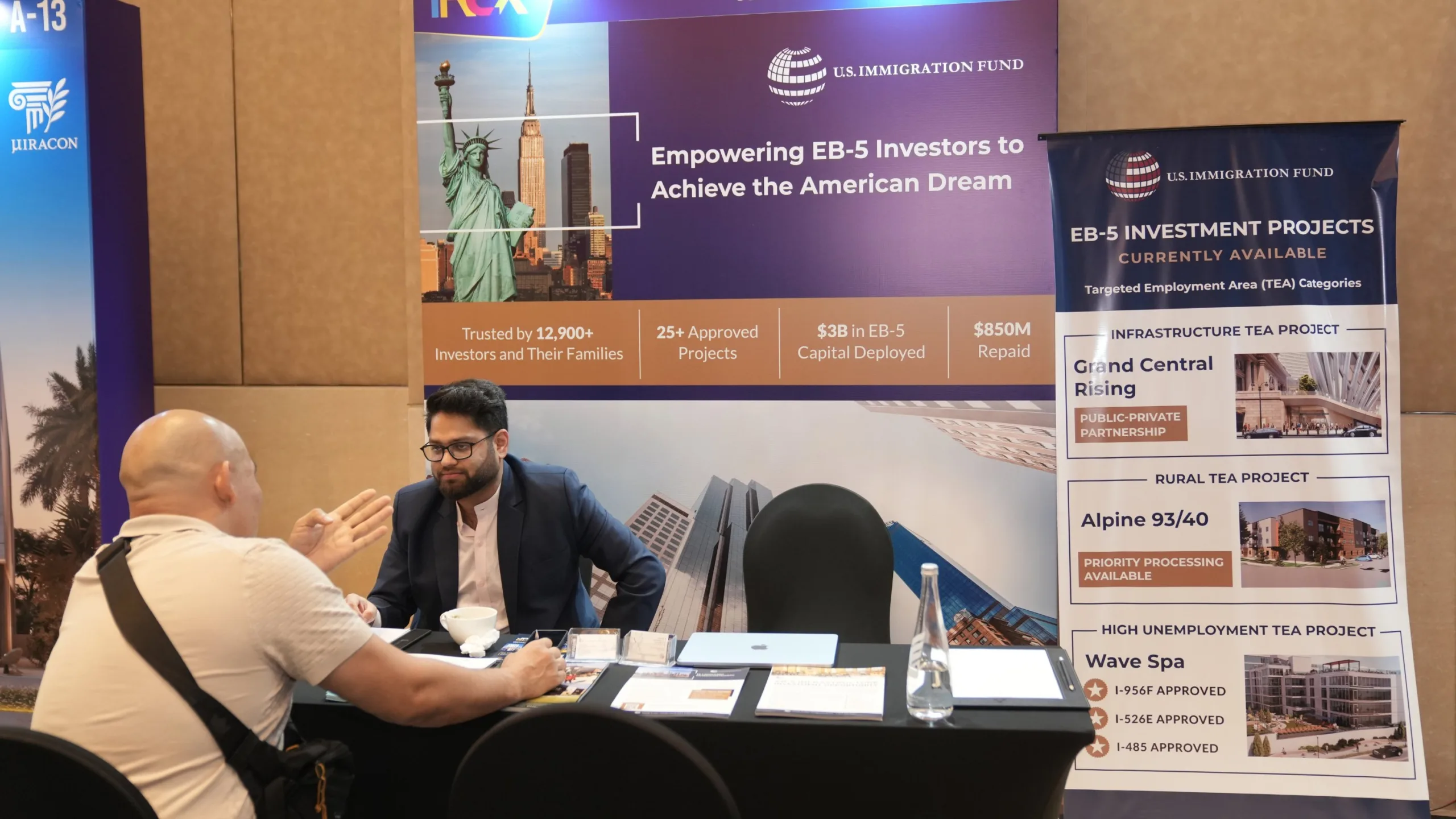 EB-5 investor consultation at U.S. Immigration Fund booth during IREX showcasing rural and infrastructure EB-5 projects